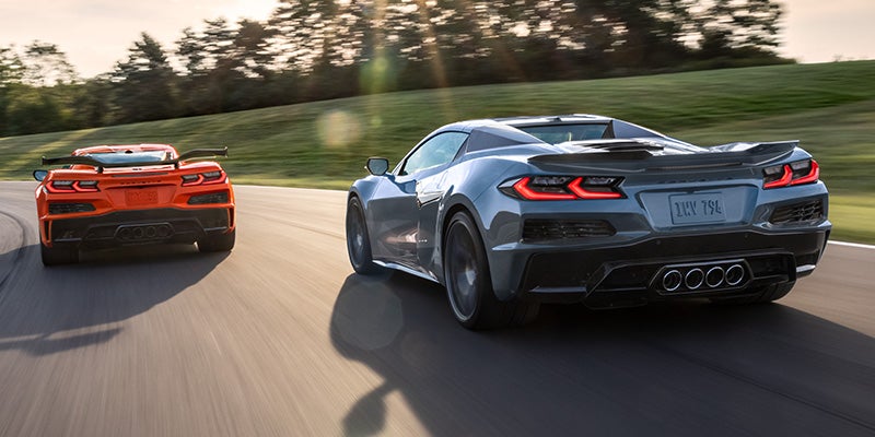 two 2027 Corvettes from Dwayne Blackmon Chevrolet driving on a raceway