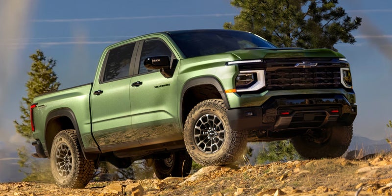 A 2027 Chevy Silverado from Dwayne Blackmon Chevrolet perched on a dirt trail
